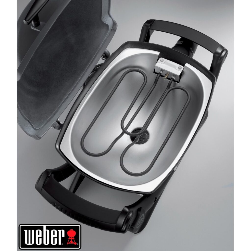Parrilla eléctrica Weber abierta y vacía.